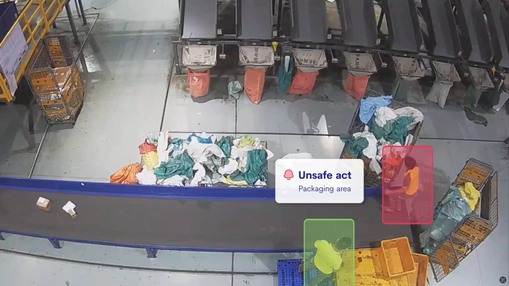 An unsafe act being committed on a conveyor belt. AI highlights and detects the act.